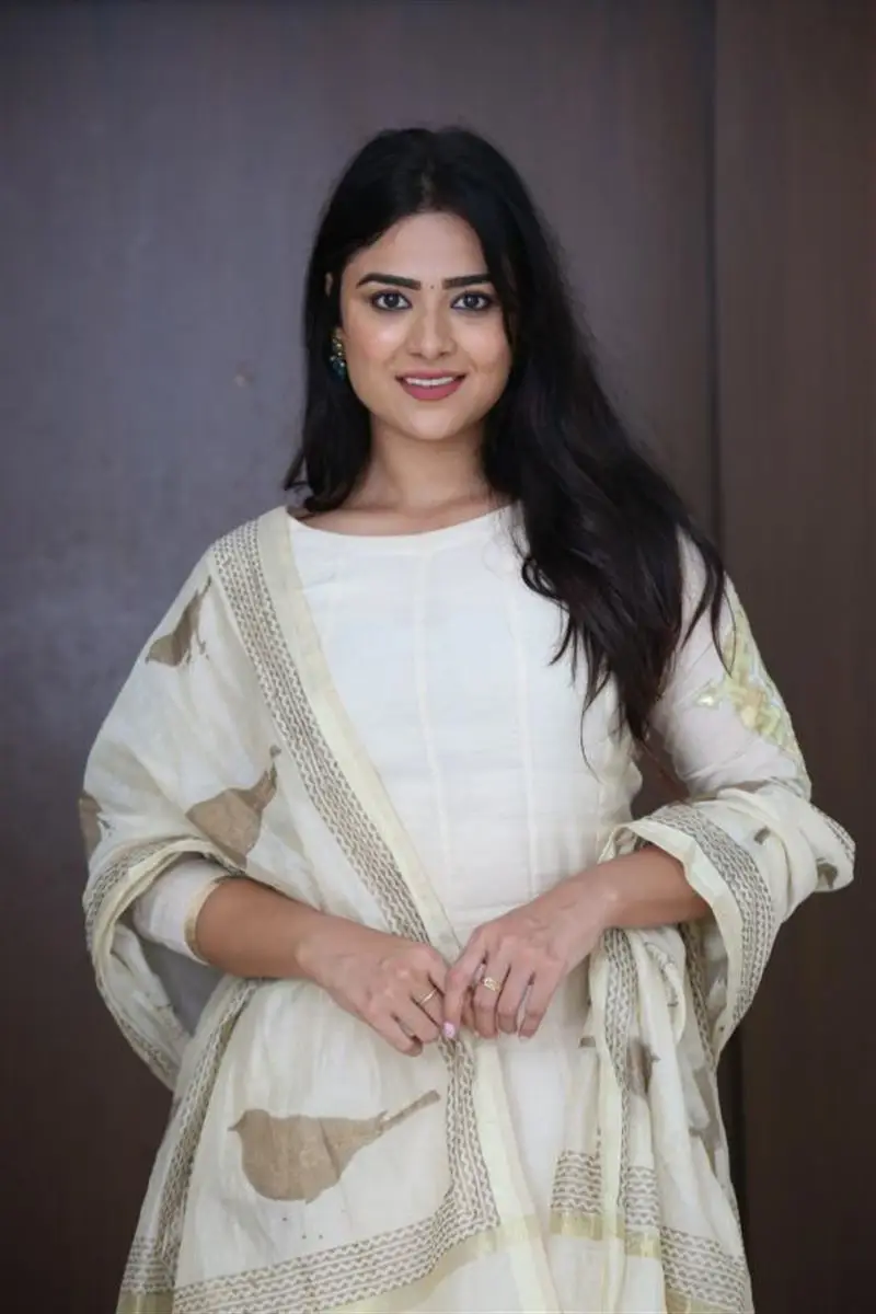 Telugu Actress Priyanka Sharma Smiling Stills in White Dress